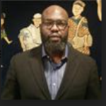 headshot of Najeem Gbadamosi